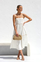 Midi dress with thin straps and ruffled skirt