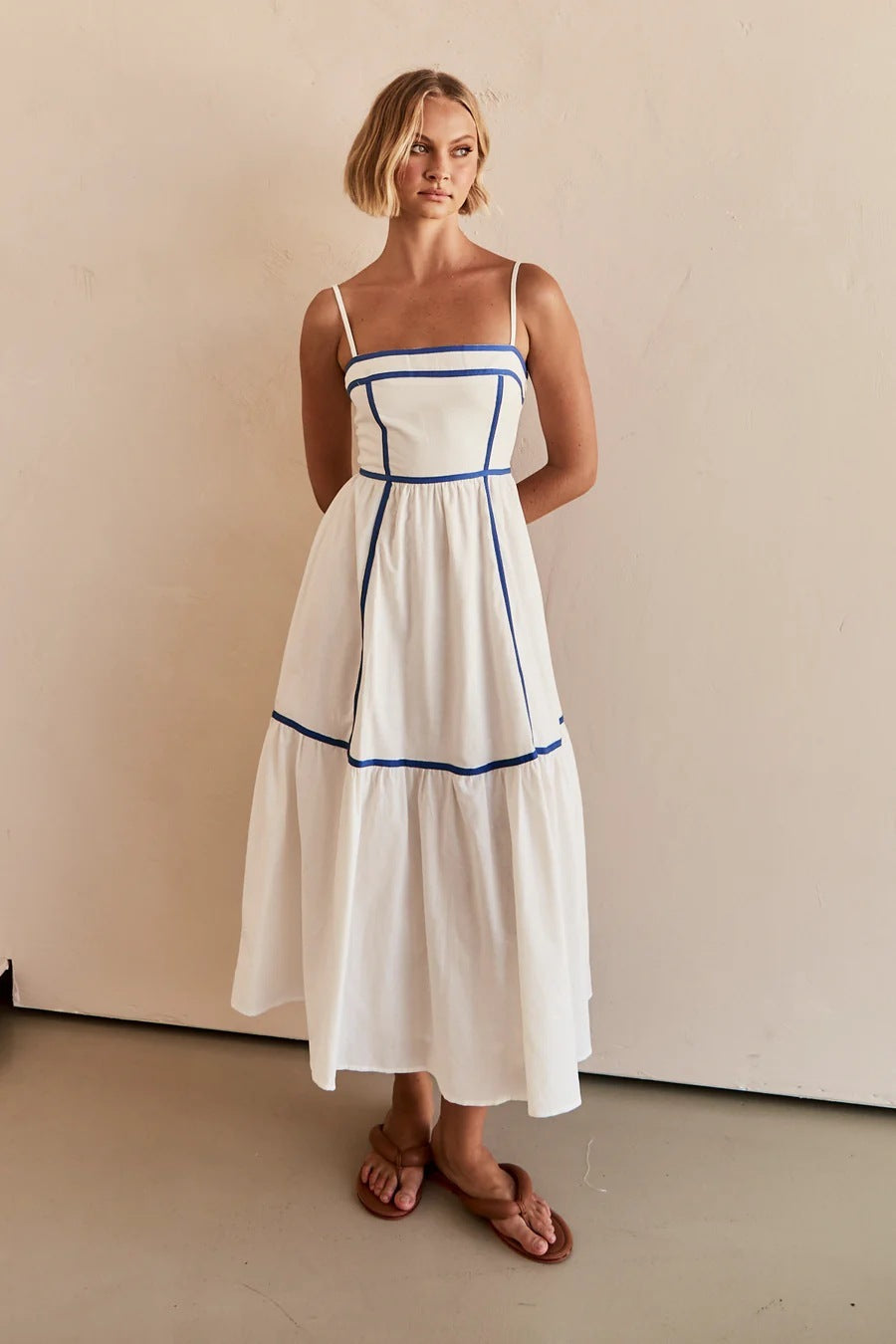 Midi dress with thin straps and ruffled skirt