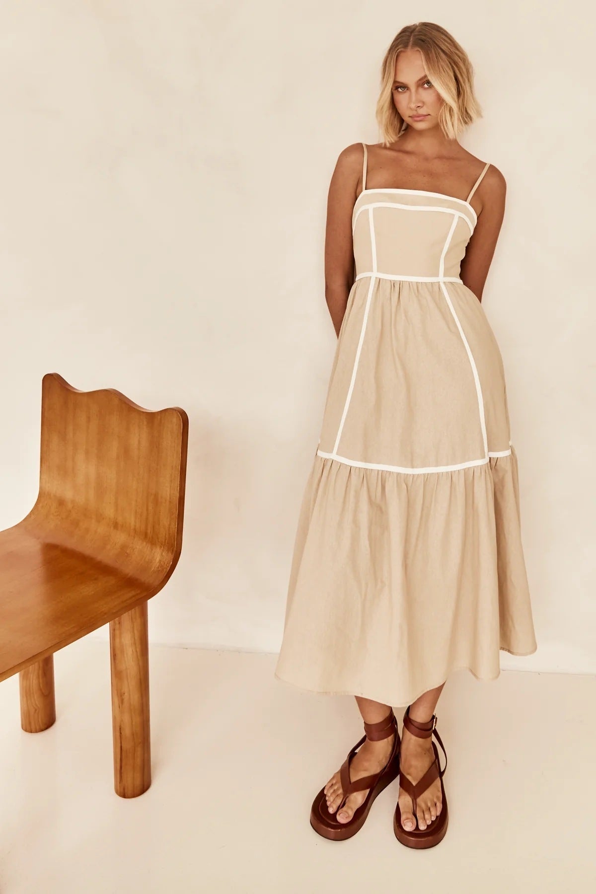 Midi dress with thin straps and ruffled skirt